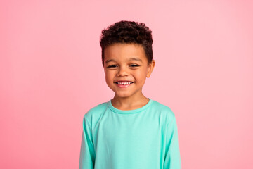 Photo portrait of adorable little boy look camera toothy smile wear trendy aquamarine garment isolated on pink color background