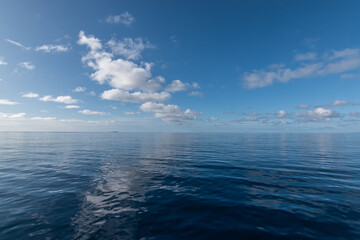 Tranquil nature background with calm sea and blue sky. Indian Ocean, Seychelles.