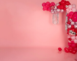 pink rose petals on a white background, red balloons