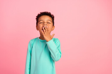 Photo portrait of cute little boy sleepy yawn cover mouth wear trendy aquamarine clothes isolated...