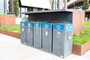 Garbage bins for separate waste collection glass, plastic, food, paper, metal, bag for walking the dog in Galataport Istanbul, Turkey. Environmental issues, recycling, reuse, zero waste