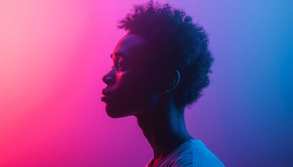 Portrait of young African man looking sideview at studio on bright pink neon background. Concept of emotions and facial expression. Copy space