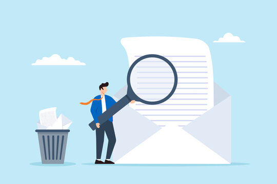 Businessman holds magnifying glass to scan emails and throw junk mail into bin, illustrating email security, and data protection. Concept of maintaining online communication technology safely