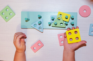 Child hand playing wooden educational teaching aids Intelligence game Kindergarten Preschool Top...