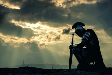 Silhouette of a Roman soldier kneeling and praying before a battle, with a stormy sky overhead. - obrazy, fototapety, plakaty