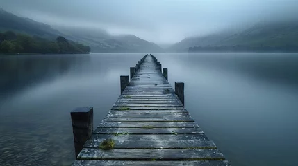 Zelfklevend Fotobehang The narrow, deserted pier extends into the vast lake, beckoning one to embrace the tranquility and grandeur of nature's expanse. © Kanisorn