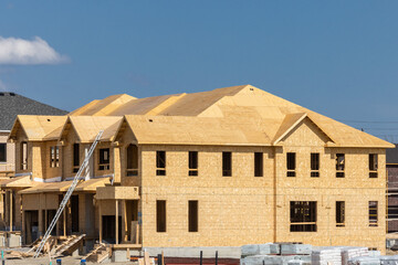 Plywood and oriented strand board or chip board roof and exterior wall sheathing of a residential...