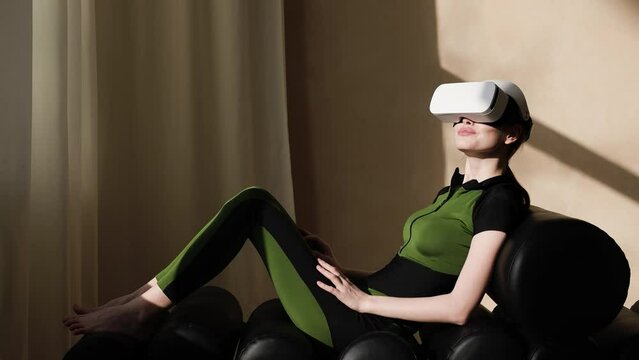 Female in modern VR glasses in futuristic home. Augmented reality game, future technology, AI concept. AR. 
