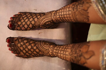 henna in legs in mendatory for the brides, it keeps the mind cool and gives a beautiful look to legs