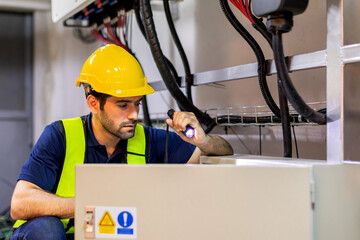 Electrical engineer working in control room. Electrical engineer man checking Power Distribution...