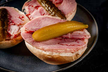 Tasty sandwich with brawn and pickled cucumber.