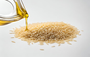 Uncooked brown rice with spoon olive oil and white background
