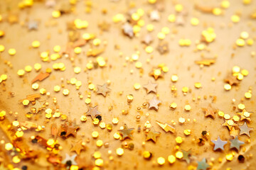 Cosmetic gel with glitter on a beige background.