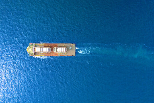 Top view Logistics and transportation large cargo ship Transporting loads of oil rig parts  Oversized cargo transportation