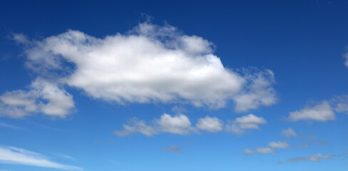 Fluffy white clouds in a blue sky 