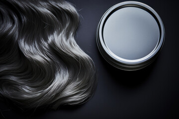 a tin of hair styling wax with a sleek design, suitable for a men's grooming product feature