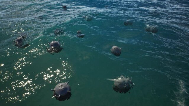 Mines float on the waves in the sea