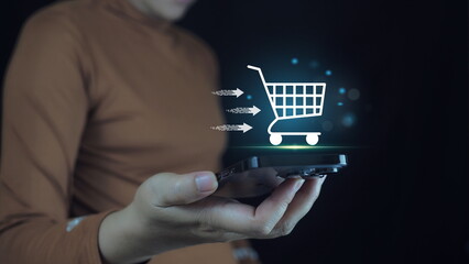 Businessman using a laptop with online shopping concept,shopping cart icons have notice messages...