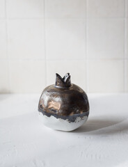 Ceramic pomegranate on a white background