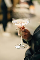 girl holding a glass of martini
