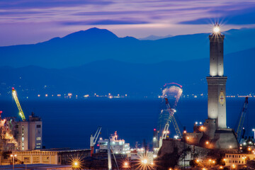 Genoa harbour and the lantern at dusk from Spianata Castelletto.