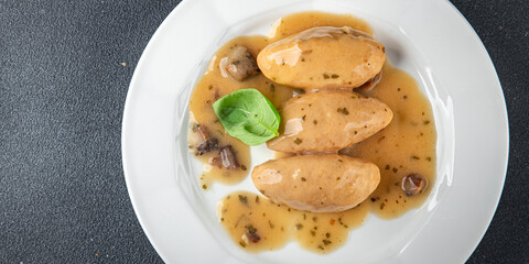 quenelles pork mushroom sauce canned food jar put food on a plate eating cooking appetizer meal food snack on the table copy space food background