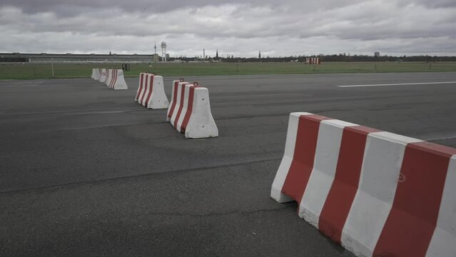 Berlin, Germany. Flughafen Berlin-Tempelhof. Unused old airport transformed into public space. People walk, ride bicycles on empty runways in Tempelhofer Feld. Tempelhofer Feld. 