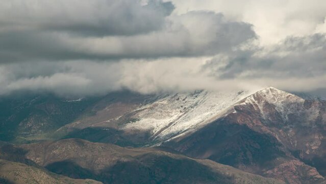 Timelapse of high mountains view with flowing clouds. Telephoto shot with decent air vibration.