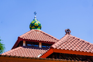 Naklejka premium a portrait of the mosque in the middle of the village as a place of worship for Muslims