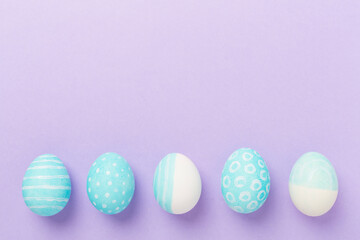Blue easter eggs on color background, top view