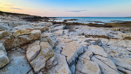 Idyllic rocky beach in tourist coastal town Medulin, Istria peninsula, Croatia, Europe. Panoramic view of rugged coastline of Kvarner Gulf in Adriatic Mediterranean Sea in summer. Travel destination