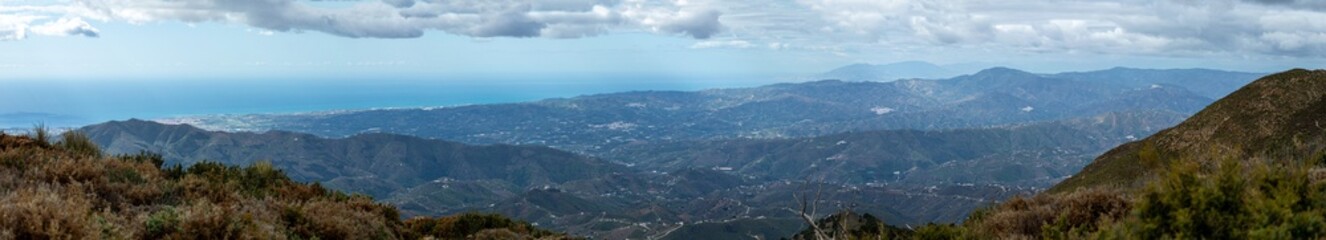 Panoramic view from hiking trail to Maroma peak in thunderstorm day, Sierra Tejeda, Spain 