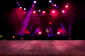 top desk with light bokeh in concert blur background,red wooden table
