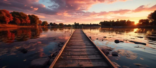 Foto op Canvas Wooden bridge on the island at sunset © MBRAMO