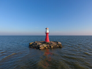 Lighthouse in Neringa, Klaipeda District, Lithuania. Baltic Sea in Background