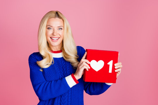 Photo of pretty lady arms hold like logo wear blue sweater isolated on pink color background