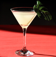 red cocktail with lime