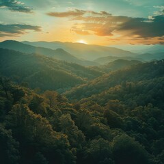 Naklejka premium Sun Setting Over Mountains and Trees
