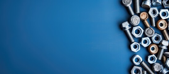 Various screws and bolts on a blue surface