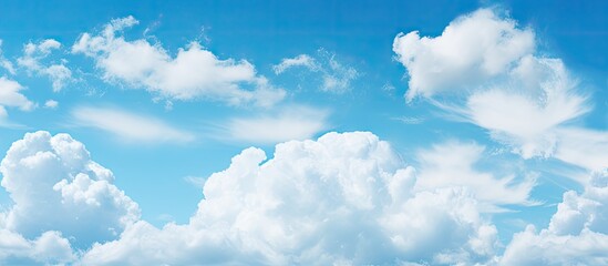 Naklejka na ściany i meble Many clouds above water, blue sky with small clouds
