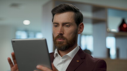 Thoughtful ceo working tablet office closeup. Businessman touching computer