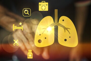 A close up of a person's hand touching a yellow lung with a bunch of medical symbols surrounding it