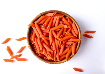 Organic Red Lentil Penne Pasta in a Wooden Bowl. Top View. Grain-Free Pasta Concept.