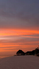 Fototapeta na wymiar Gorgeous sunset over serene beach breathtaking summer landscape on Maldives