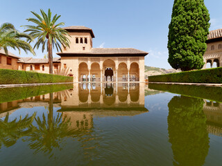 Garden of the Partal,  Alhambra Granada. Reflection in the water. Moorish Architecture. Unesco Unesco World Heritage Spain. Travel in time and discover history. 