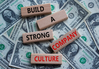 Company culture symbol. Wooden blocks with words Build a strong company culture. Beautiful dollar...
