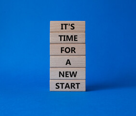 Time for a new start symbol. Wooden blocks with words Time for a new start. Beautiful blue background. Business and Time for a new start concept. Copy space.