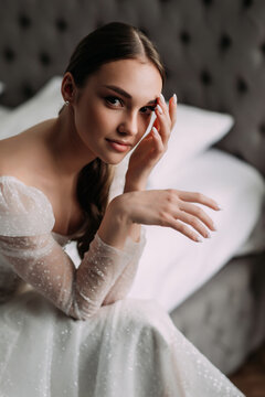 The image features a woman in a white wedding dress, posing indoors for a photo shoot 6541.