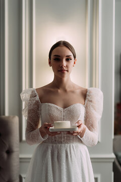 The image features a person in a white wedding dress holding a white cup 6549.
