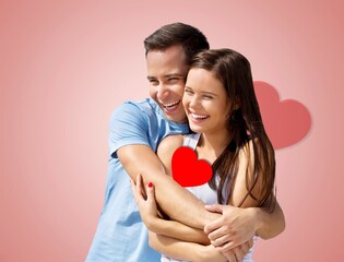 Portrait of lovely couple posing with hearts